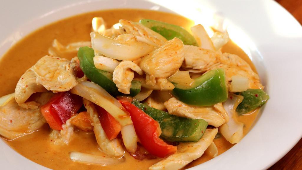 Spicy Curry (Medium) · Red curry sautéed with creamy coconut milk, jalapenos, onions, and bell peppers.