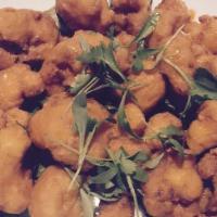 Buffalo Cauliflower · Served with Housemade Creamy Ranch Dressing and Bleu Cheese Crumble