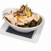 Shishito Peppers · Sauteed Shishito Peppers served with Crispy Pork Skins tossed in White Soy Garlic Sauce garn...