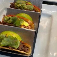 Short Rib Tacos · Three Mini Corn Tortilla Shells filled with Braised “Oaxaca Style” Short Rib served with Lim...