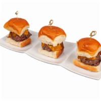 Beef Sliders · Three Freshly Ground Beef Patties served with Caramelized Onions and Cheddar Cheese on King'...