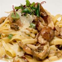 Pasta With Truffle Mushroom Sauce · Sautéed with baby portabellos, parmesan cheese, & truffle oil.