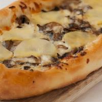 Truffled Mushroom + Potato Pizza 3Ft · organic creme seasoned with garlic + shallots, potato, truffle oil + mozzarella on our artis...