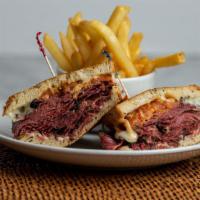 Pastrami Melt Sandwich · Slices of hot corned pastrami with melted provolone cheese and tomato on grilled rye bread. ...