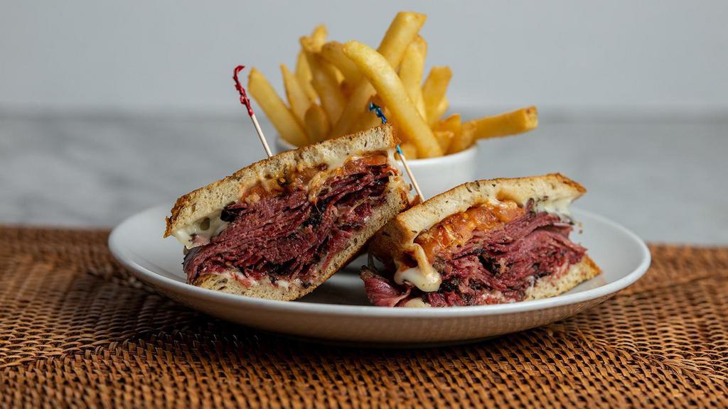 Pastrami Melt Sandwich · Slices of hot corned pastrami with melted provolone cheese and tomato on grilled rye bread. Served with your choice of coleslaw, potato salad, macaroni salad, pasta salad or french fries.