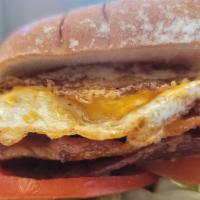 Bacon & Egg Sandwich · Bacon, egg, lettuce, tomato, pickles, and onions on toasted bread.
