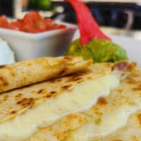 Quesadillas · Three flour tortillas filled with Monterey jack cheese. 
Served with pico de gallo, crema an...