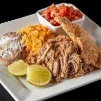 Carnitas · Slowly cooked pork loin.  Served with rice, refried beans, pico de gallo, chicharron, avocad...