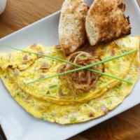 The Denver Omelette · Bell pepper, onion, and tomato folded into a freshly made omelette and served with house-mad...
