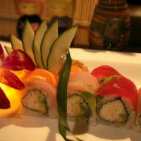 Rainbow Roll · Crab, avocado and cucumber inside topped with tuna, salmon, yellowtail and white fish and to...