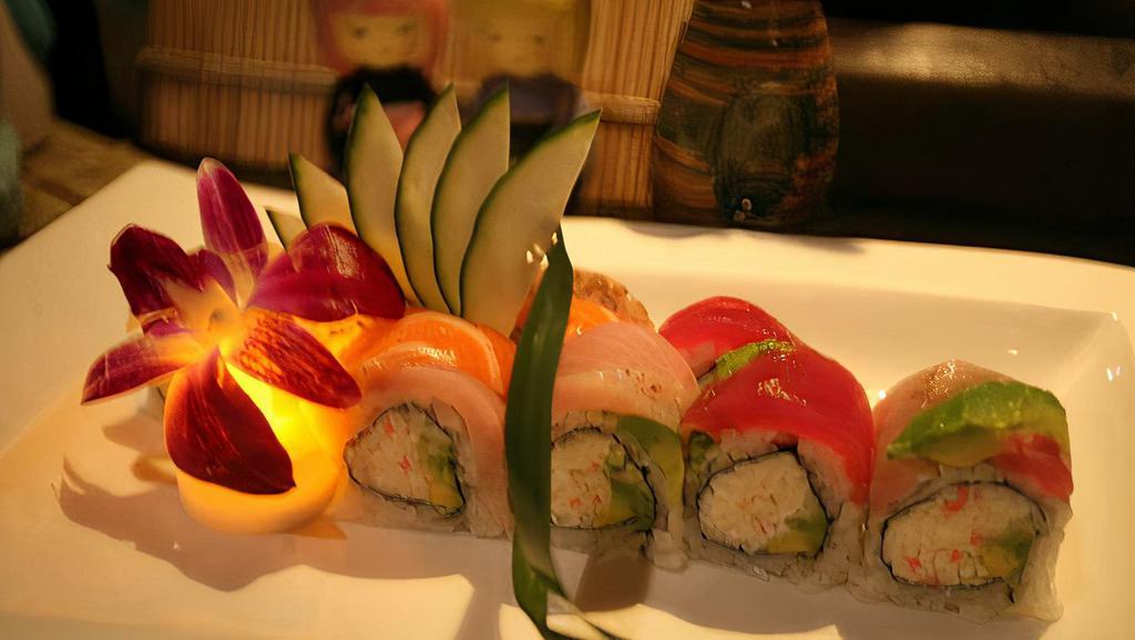 Rainbow Roll · Crab, avocado and cucumber inside topped with tuna, salmon, yellowtail and white fish and tobiko.