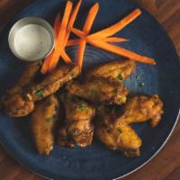 Roasted Chicken Wings · Buffalo, grilled pineapple habañero or Tamarind BBQ Sauce.