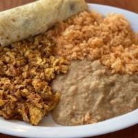 Chorizo And Eggs · Three eggs scrambled on the grill with fresh chorizo. Served with our homemade rice, refried...