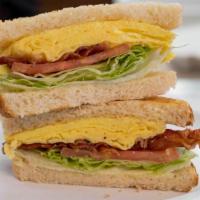 Bacon & Egg Sandwich · Two eggs, chopped smokey bacon, fresh sliced tomato, crisp leaf lettuce and mayo on your cho...