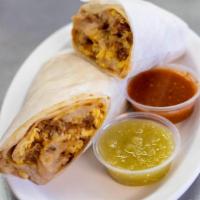 Chorizo Breakfast Burrito · Three eggs scrambled on the grill with fresh chorizo, refried beans crispy hashbrowns, Monte...