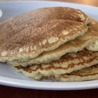 Full Stack · Four fluffy buttermilk pancakes served with whipped butter and syrup.