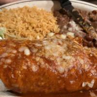 Carne Asada Burrito · Filled with carne asada, enchilada sauce, pico De gallo, rice and beans, topped with enchila...