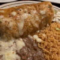 Carnitas Burrito · Comes with rice and choice of refried or black beans.