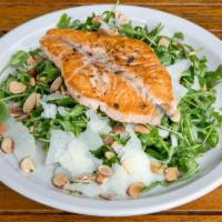 Arugula Salad · Wild baby arugula, shaved parmesan cheese and toasted almonds, tossed with our house-made le...