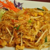 Pad Thai · Thai style pan fired thin rice noodle with eggs, tofu, bean sprouts, green onions, fresh lim...