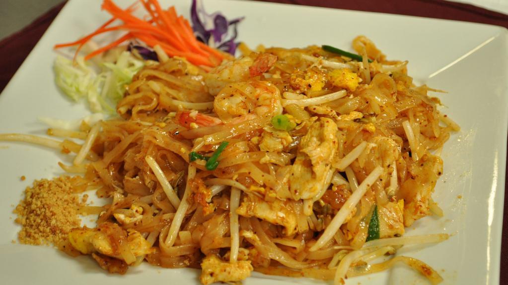 Pad Thai · Thai style pan fired thin rice noodle with eggs, tofu, bean sprouts, green onions, fresh lime and ground peanuts.