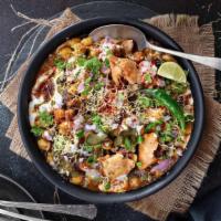 Samosa Chaat · Vegan. Indian potato patties served with garbanzo beans and topped with yogurt, mint sauce, ...