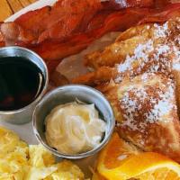 French Toast · Served with two eggs and bacon or sausage links (substitute sausage patty or ham for an addi...