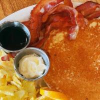 Short Stack · Two pancakes served with two eggs and bacon or
sausage links (substitute sausage patty or ha...
