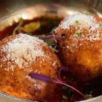 Arancini · Two Fried Balls of Risotto, Stuffed with Caramelized Onions, Fontina, Mozzarella, Served wit...