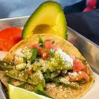 Nopal Taco · Grilled cactus, guacamole, pico de gallo, cotija cheese and chile poblano salsa.