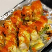 #117. Lion King Rol · Kani, avocado, salmon seared, masago with sauces.
