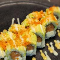 #112. Philly Roll · Cream cheese, salmon, avocado, masago with sauce.
