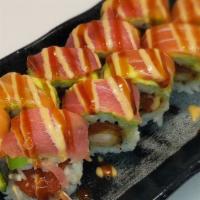 #126. Scott Roll · Spicy tuna, shrimp tempura, cucumber, tuna, salmon, avocado and sauces.