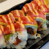 #123. In And Out Roll · Spicy tuna roll topped with tuna and avocado with sauces.