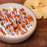 Hot-Bling Honey Chicken Loaded Queso · What's not to like.. It has all the toppings! QDOBA's classic three-cheese queso loaded with...