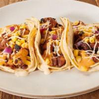 3-Pack Gold Rush Tacos · These tacos start with gooey 3-Cheese Queso layered in between 2 tortillas (flour or corn), ...