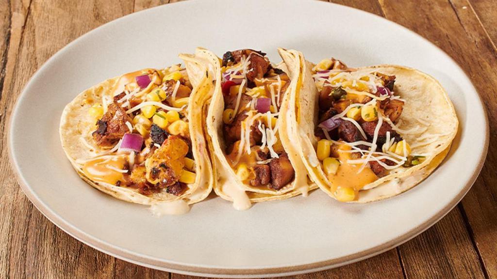 3-Pack Gold Rush Tacos · These tacos start with gooey 3-Cheese Queso layered in between 2 tortillas (flour or corn), then are filled with protein and toppings. Talk about a rush of flavor!