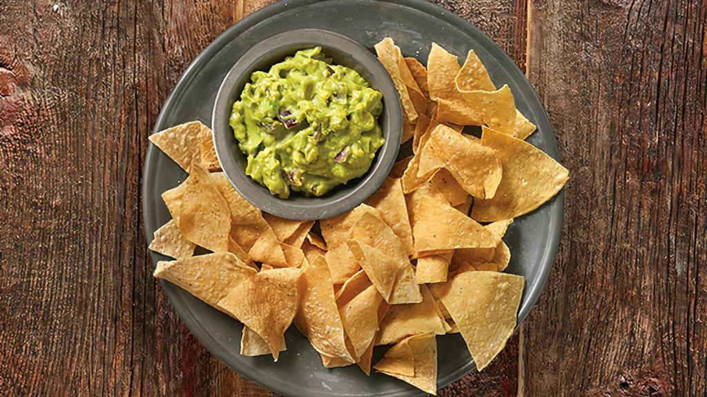 Hand-Crafted Guacamole & Chips · Hand-crafted guac made-in-house daily, served with freshly fried tortilla chips seasoned with salt and lime.
