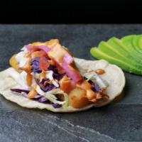 Fish Taco · Corn or flour tortilla with beer battered fish adorned with pickled red onion, red and green...