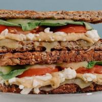 The Ultimate Grilled Cheese · Toasted Sprouted Bread, Cheddar Cheese, Feta, Provolone Cheese, Hummus, Tomato & Spinach