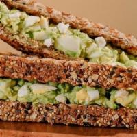 The Egg Salad Sandwich · Toasted Sprouted Bread, Hard-Boiled Egg, Avocado, Feta, Himalayan Pink Salt, Black Pepper & ...