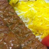 Beef Koobideh Kebab · 2 skewers of ground beef seasoned with onions and spices. Served with hummus, garlic sauce, ...