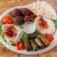 Family Combination (Vegetarian) · Combination of falafel, hummus, dolma, and baba ganoush.