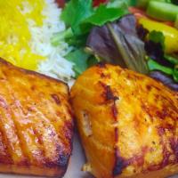 Salmon Kebab · Seasoned fresh grilled wild salmon fillet. Served with hummus, garlic sauce, and choice of 2...