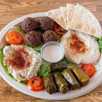 Family Combination (Vegetarian) · Combination of falafel, hummus, dolma, and baba ganoush. Served with pitas.