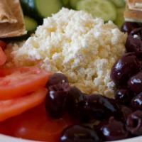 Feta Plate · Combination of feta cheese, tomato, Kalamata olives, and cucumbers. Served with pitas.