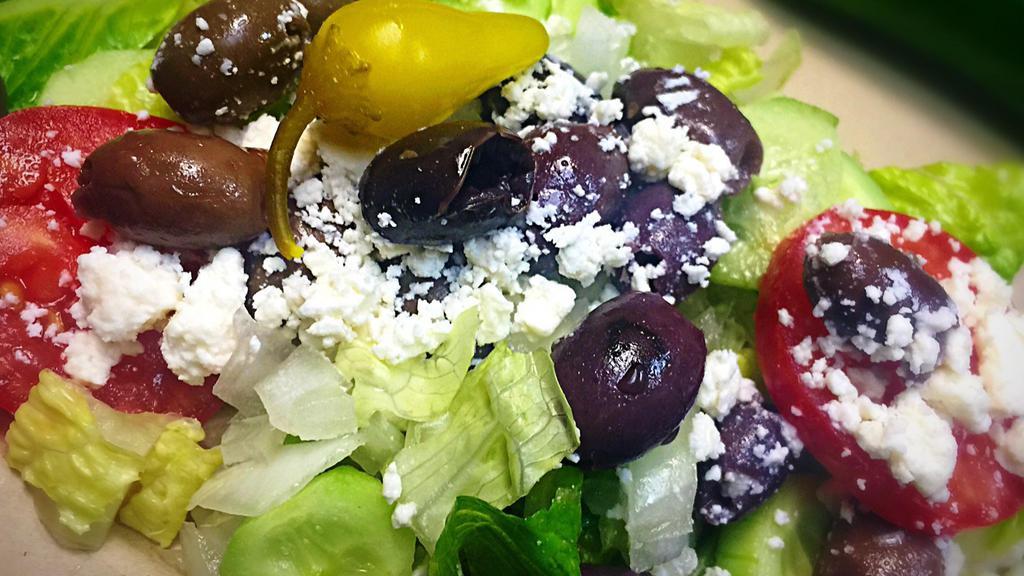 Greek Salad · Romaine lettuce, tomato, cucumber, onion, feta cheese, Kalamata olives, and balsamic vinaigrette.