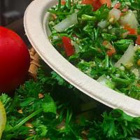 Tabouli Salad · Chopped parsley, diced tomatoes, cracked wheat, green onions, herbs, lemon juice, and extra ...