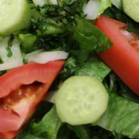 Garden Salad · Romaine lettuce, tomatoes, cucumber, onions, and balsamic vinaigrette.