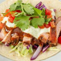 Jerk Pork Taco · Marinated in signature jerk spices, then cooked low and slow until fork tender.